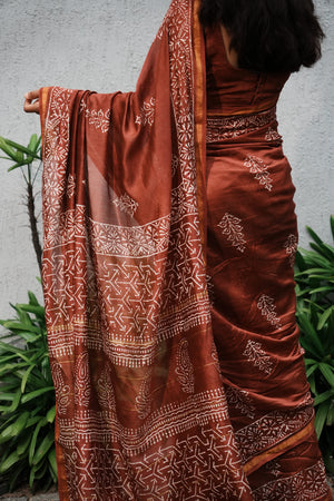 Mehr rust brown Chanderi silk cotton saree showing handblocked border and pallu
