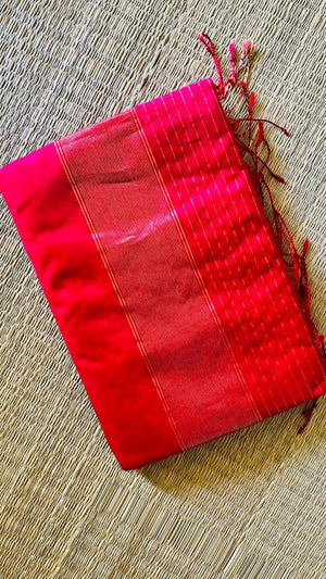 Folded Ranjani Maheswari silk cotton saree showing the zari-striped pallu and tassels