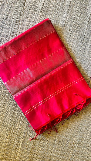 Folded Ranjani handwoven Maheswari saree showing pink body, zari border, and tassels