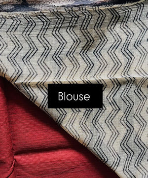 Ivory and black zigzag blouse fabric shown with Ruhani brick red Kota Doria saree