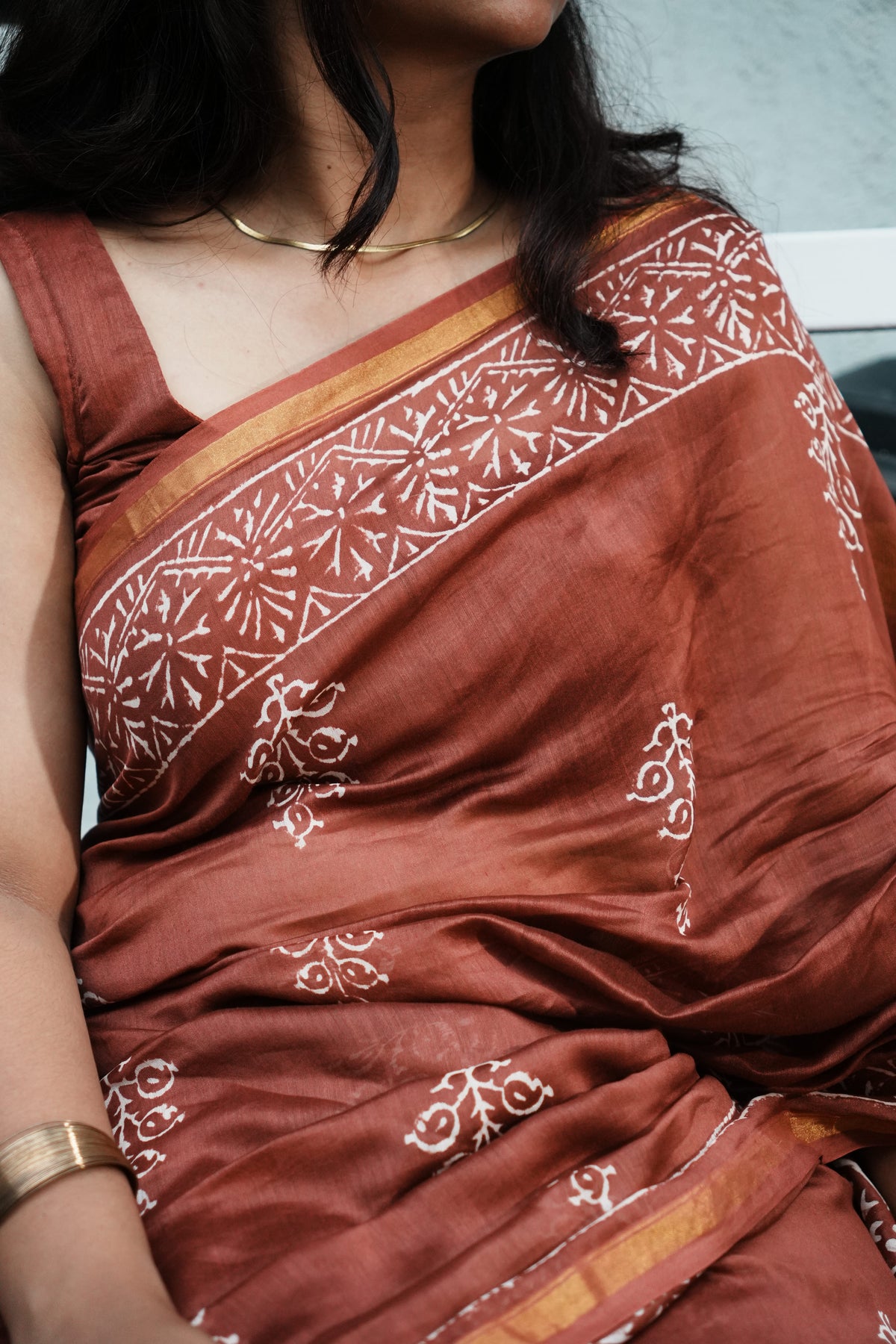 Model wearing Mehr rust brown Chanderi silk cotton handblocked saree
