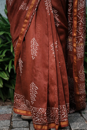 Mehr rust brown Chanderi silk cotton saree with handblocked motifs, close drape view