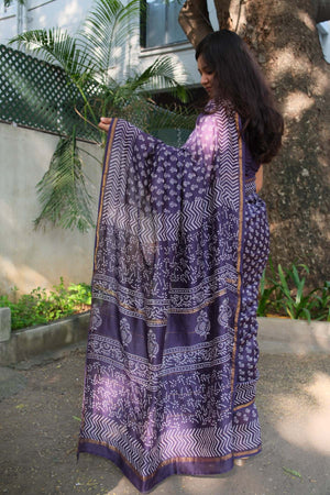 Aadhira saree showing the purple and white patterned pallu with floral and paisley-inspired details