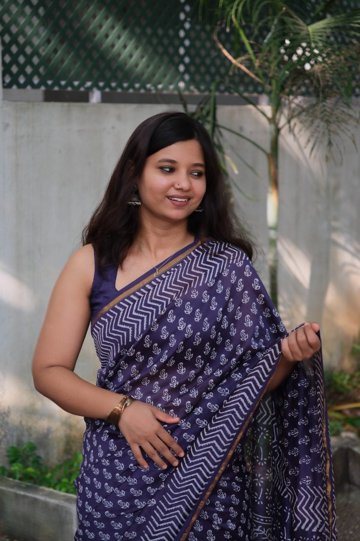 Aadhira purple Chanderi silk cotton saree with white motifs and chevron borders, front view