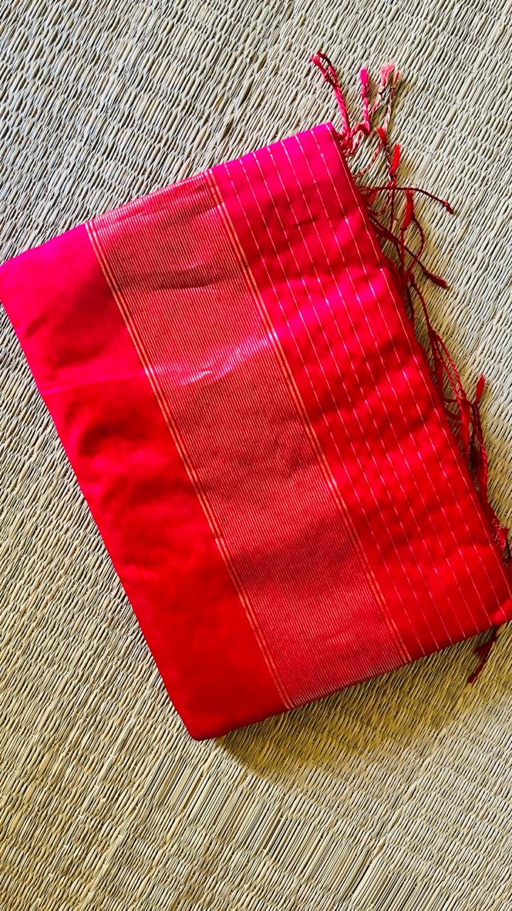 Folded Ranjani Maheswari silk cotton saree showing the zari-striped pallu and tassels