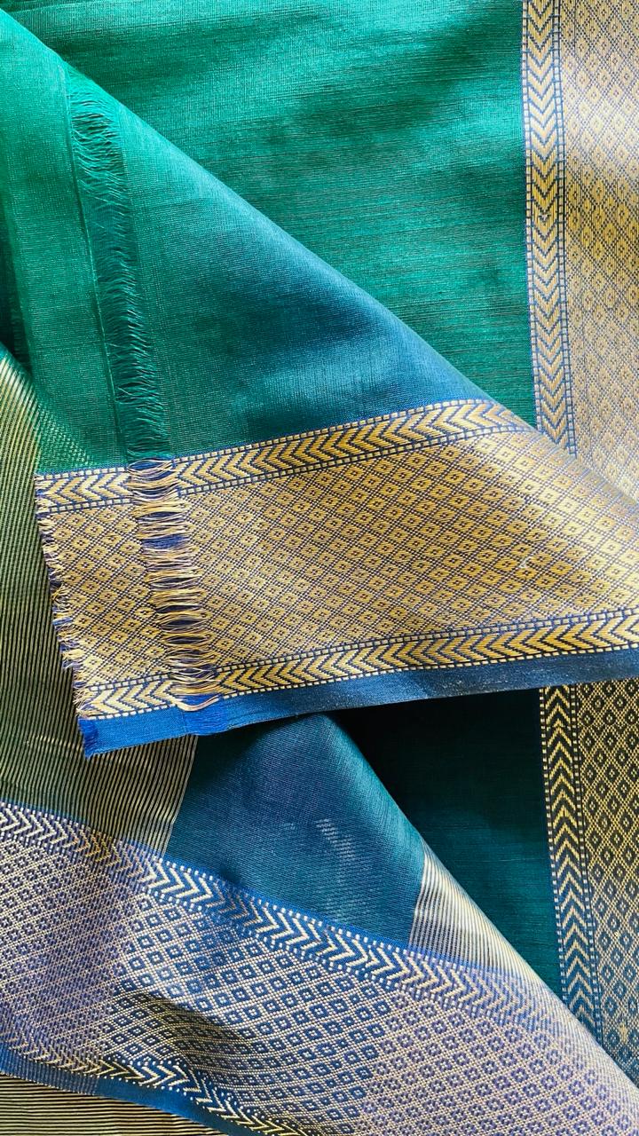 Close-up of Ahalya Maheswari saree showing double-woven blue body and intricate zari border