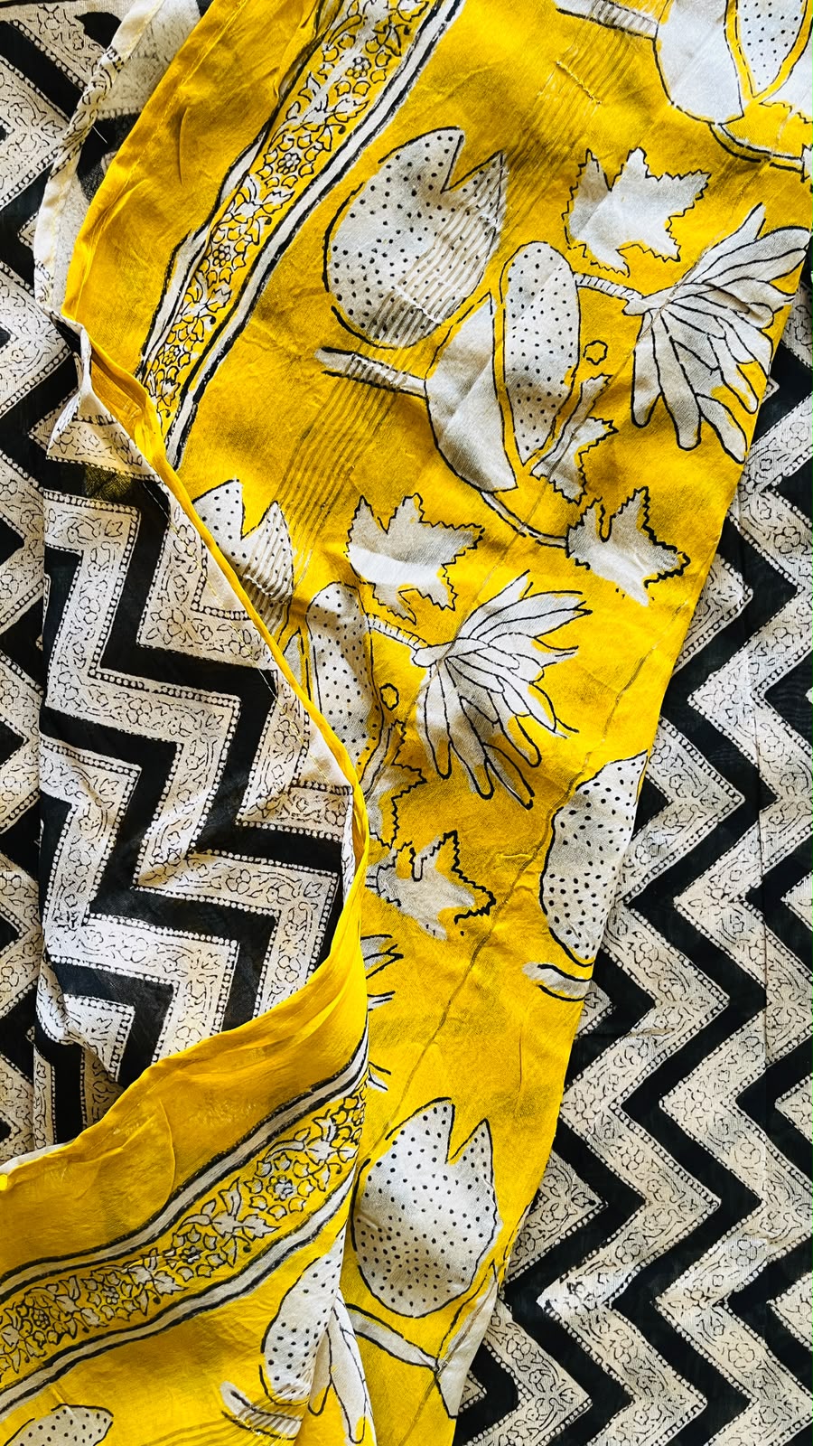 Haldi-yellow handblocked Maheswari silk cotton saree with bold botanical motifs and contrasting border