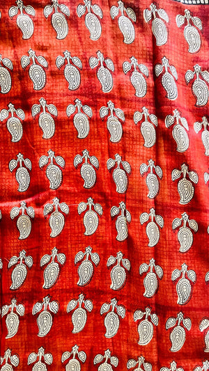 Maheswari handblocked saree showing the black geometric grid border on a warm ivory base