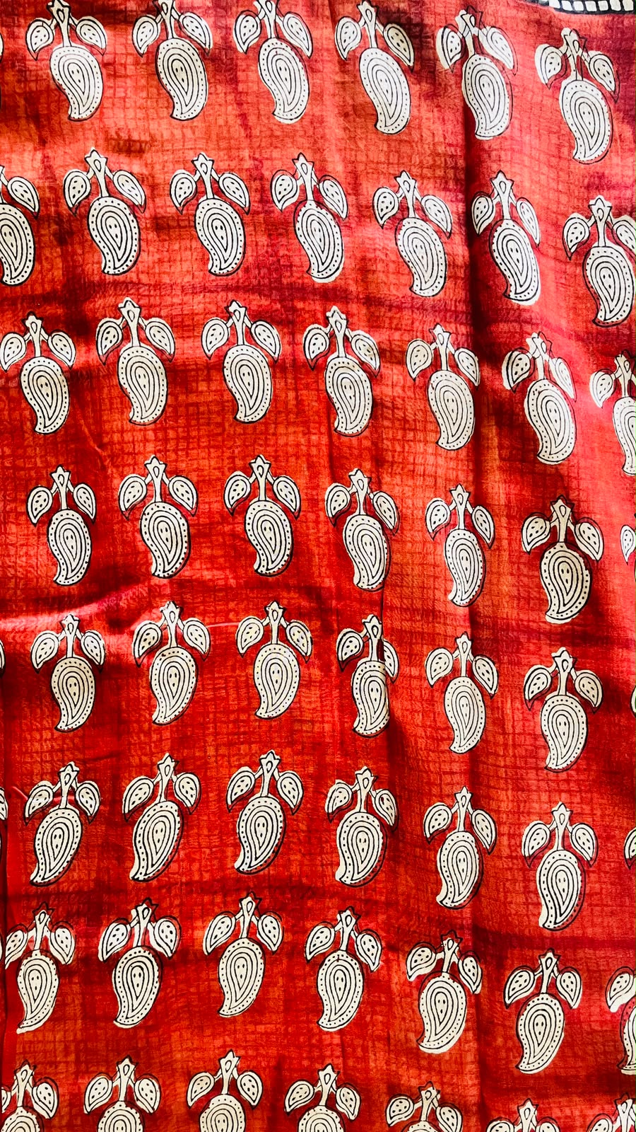 Maheswari handblocked saree showing the black geometric grid border on a warm ivory base