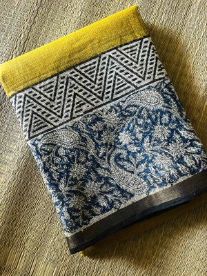 Neelambari Kota Doria Saree folded to show mustard yellow, indigo paisley florals and geometric detailing